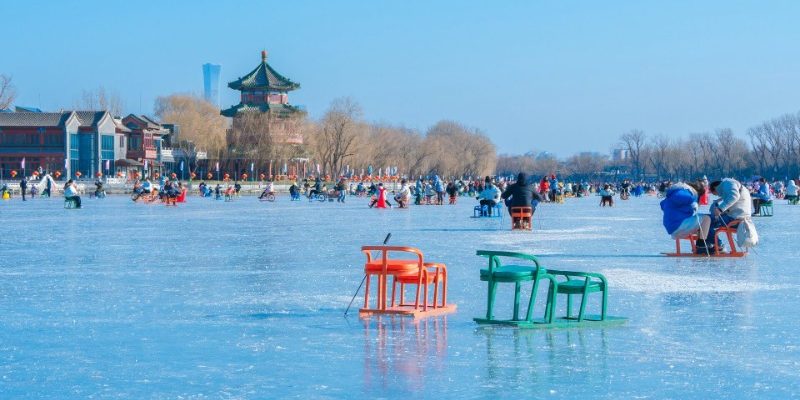 Skating-Shichahai-Beijing In winter, the surface of Shichahai Lake is frozen, and visitors are ice skating.