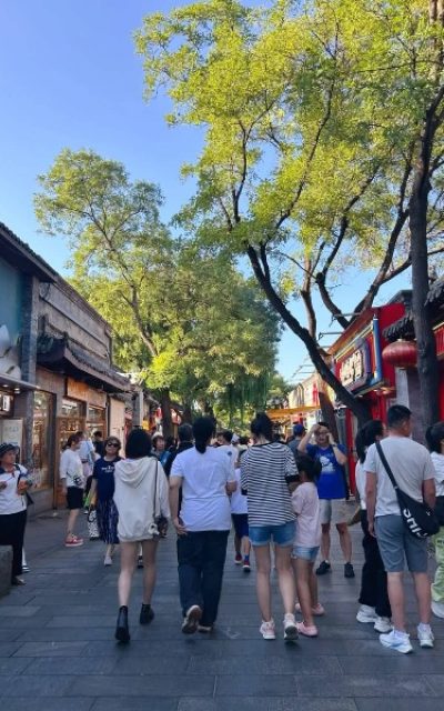Tourist-Nanluogu Lane-Beijing Hutong The bustling crowds of tourists are happily strolling through Nanluoguxiang.