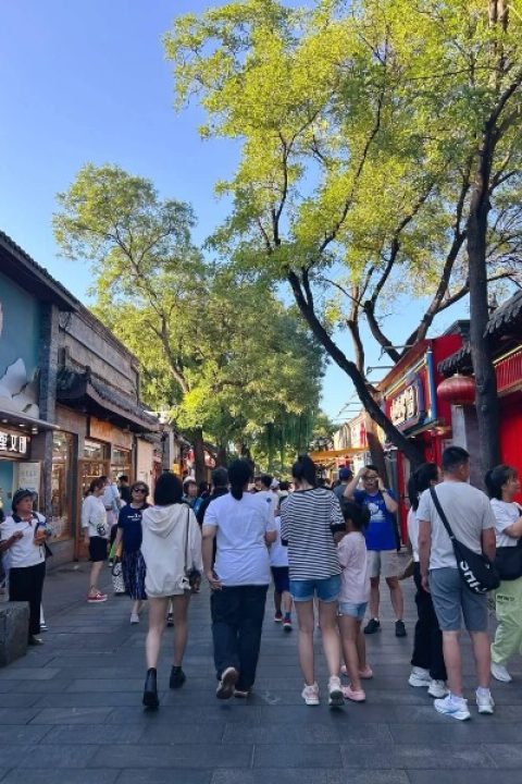 Tourist-Nanluogu Lane-Beijing Hutong The bustling crowds of tourists are happily strolling through Nanluoguxiang.