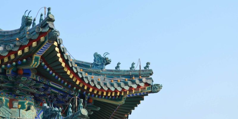 Traditional Chinese eaves-Guodu-Beijing The blue eaves are adorned with many small statues of ancient Chinese mythical creatures.