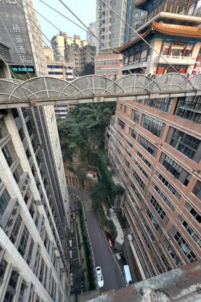 View 4-Kweixing Tower-Chongqing On one side of Kuixing Tower is a busy street, and on the other side is the top of a 22-story building.