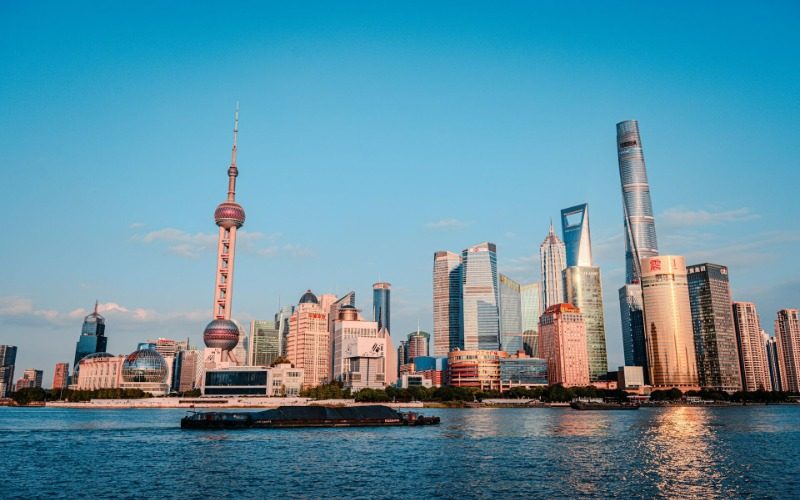 View-Lujiazui-Shanghai The cargo ships on the Huangpu River have the bustling Lujiazui of Shanghai in the background.