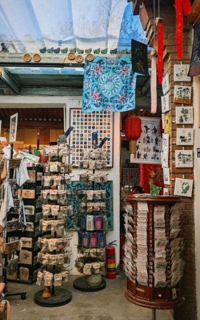 Yangmeizhu Xiejie-Hutong Guide-Beijing The small shop in a Beijing hutong is filled with traditional Chinese handicrafts.